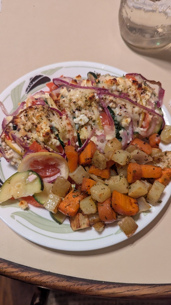 Milford, NH, USA :: Greek stuffed chicken with roasted veggies.  Thinly sliced zucchini, tomato, red onion, and lemon.  Made 5 slices in a chicken breast and brushed it with a mix of olive oil, fresh dill, and fresh parsley.  Then stuffed each of the five slices with a piece of the aforementioned veggies / fruit.  Topped with feta and shredded mozzarella.  Roasted veggies consisted of seasoned potato, carrot, and onion chunks.